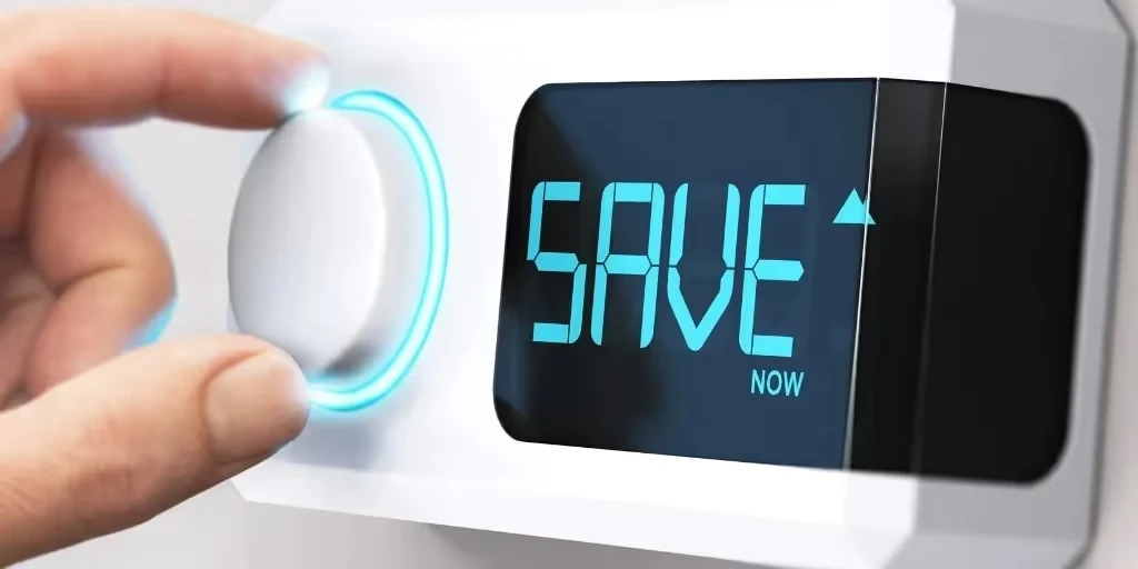 Digital display showing "SAVE NOW" with hand adjusting glowing dial