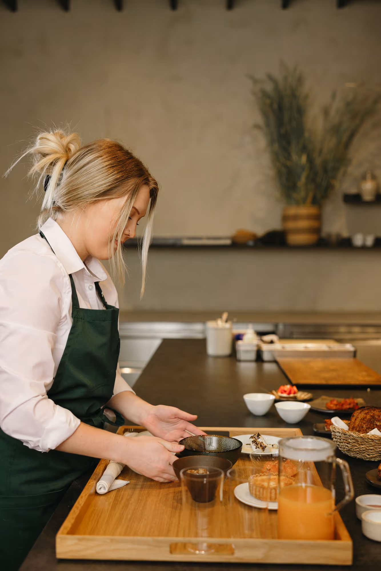 In-room dining server preparing breakfast