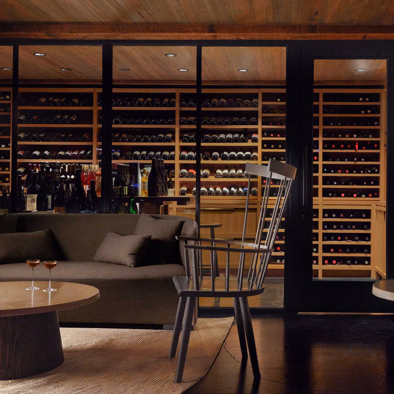 Wine cellar with floor-to-ceiling wine storage and tasting seating