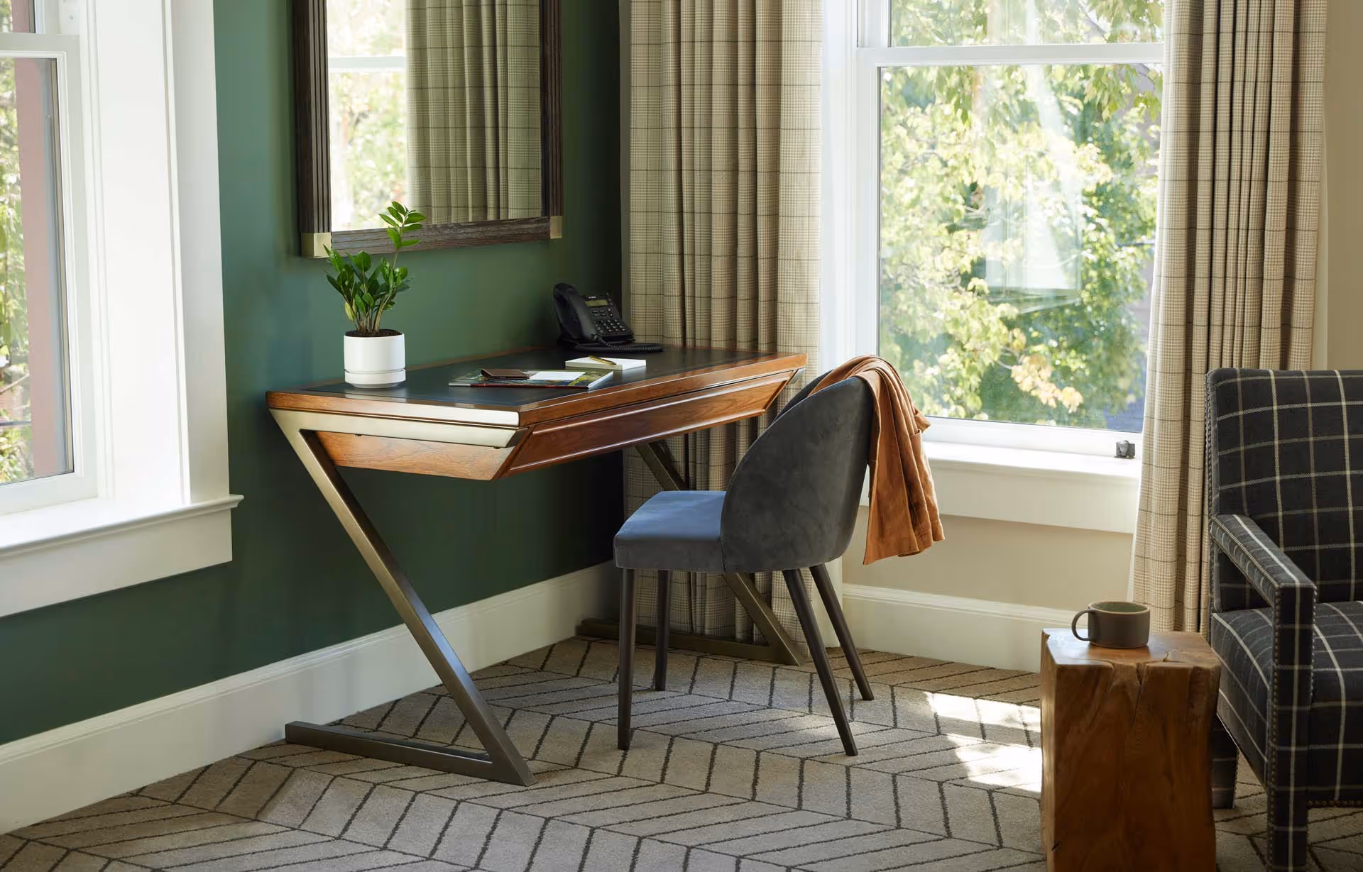 Writing desk with sunshine coming through window in Rogue Suite