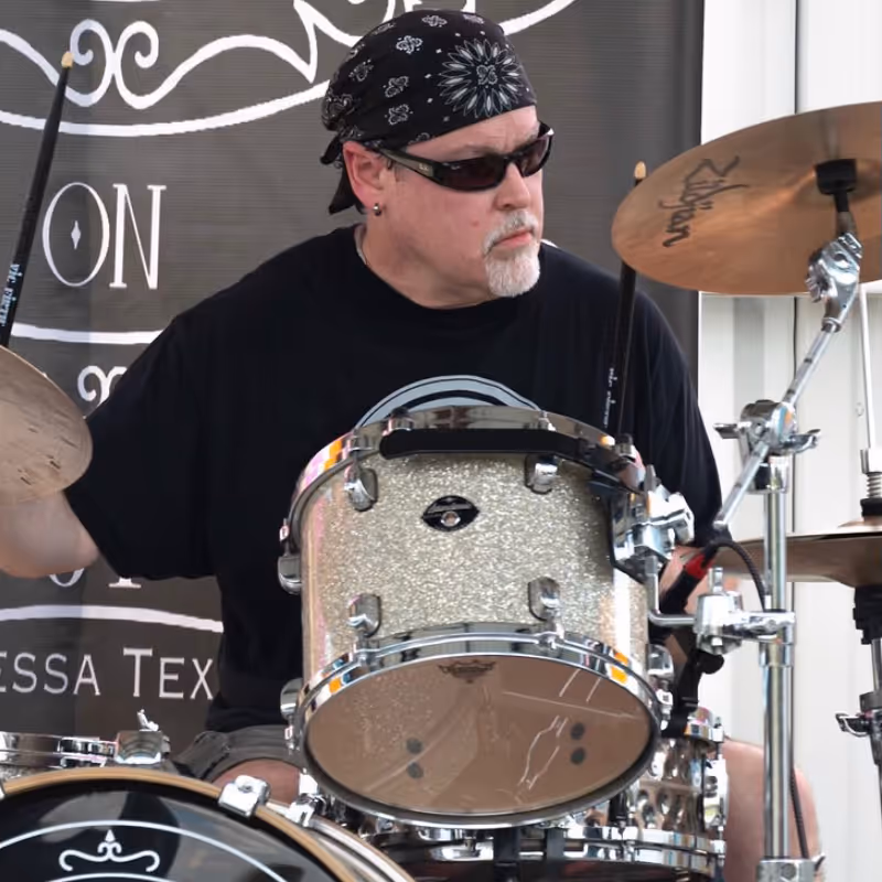 Phil Hodges drumming at a concert.