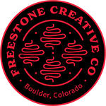Freestone Creative Co. circular logo with abstract red lines on black background, text 'Boulder, Colorado' at bottom.