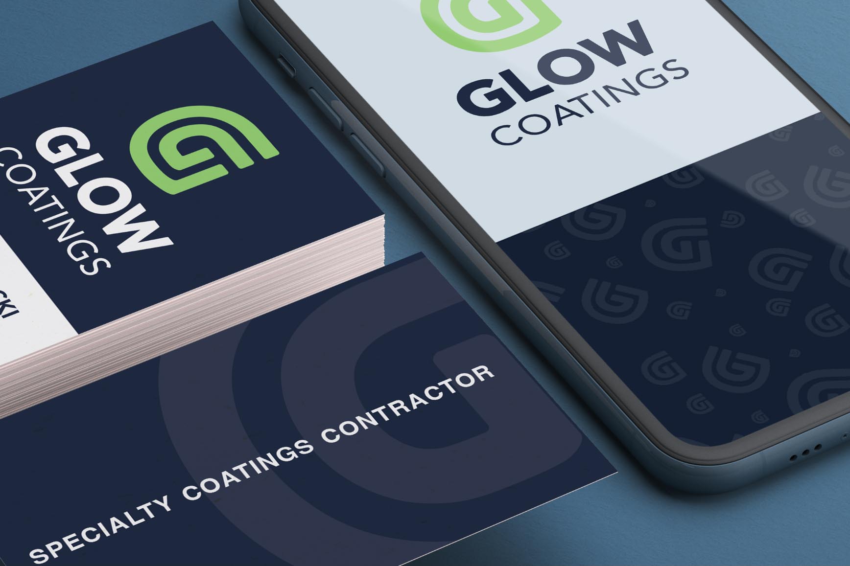 An example of Glow Coatings branding used in real life circumstances. Logos are seen in an iphone and on business cards.