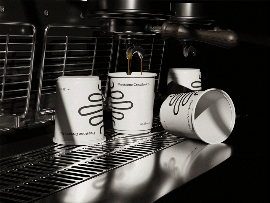A GIF of Freestone Creative Co. branded espresso cups under a functioning espresso machine in a cafe.