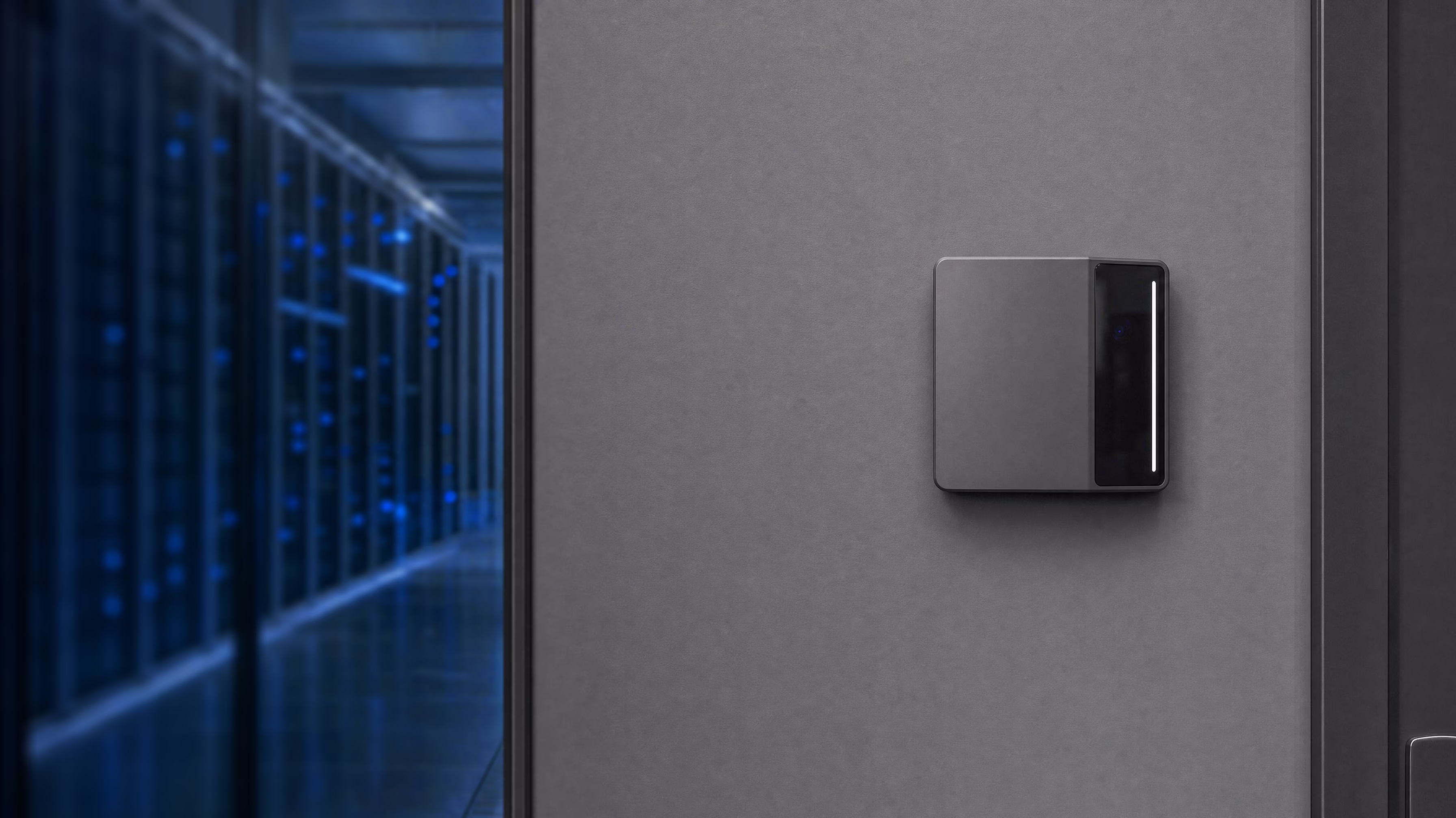 Rock X mounted on the wall beside a glass-walled data center hall