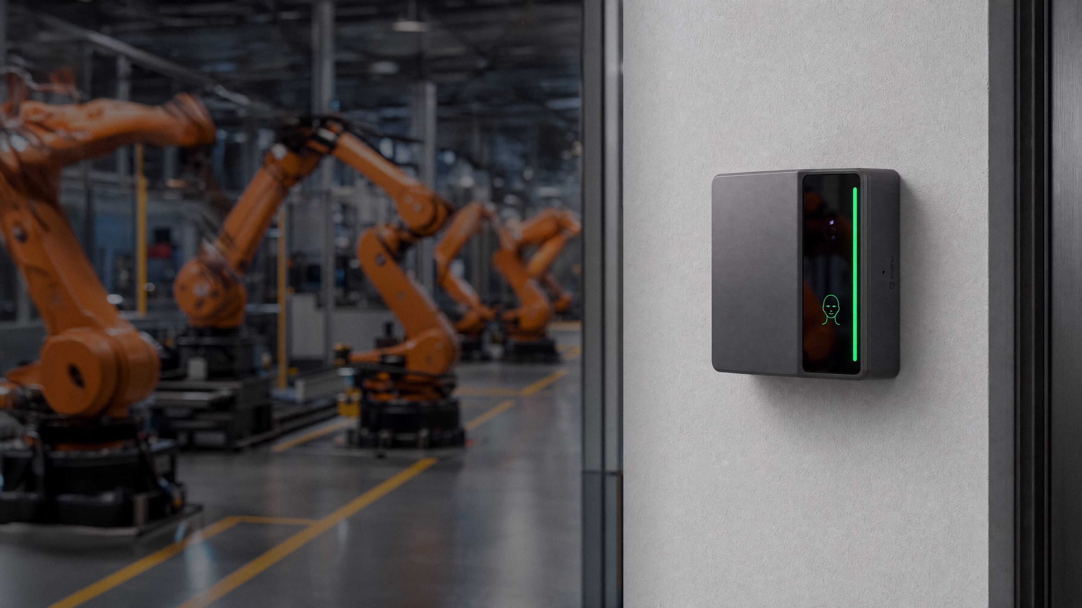 Rock X mounted beside a glazed wall overlooking a robotic assembly line
