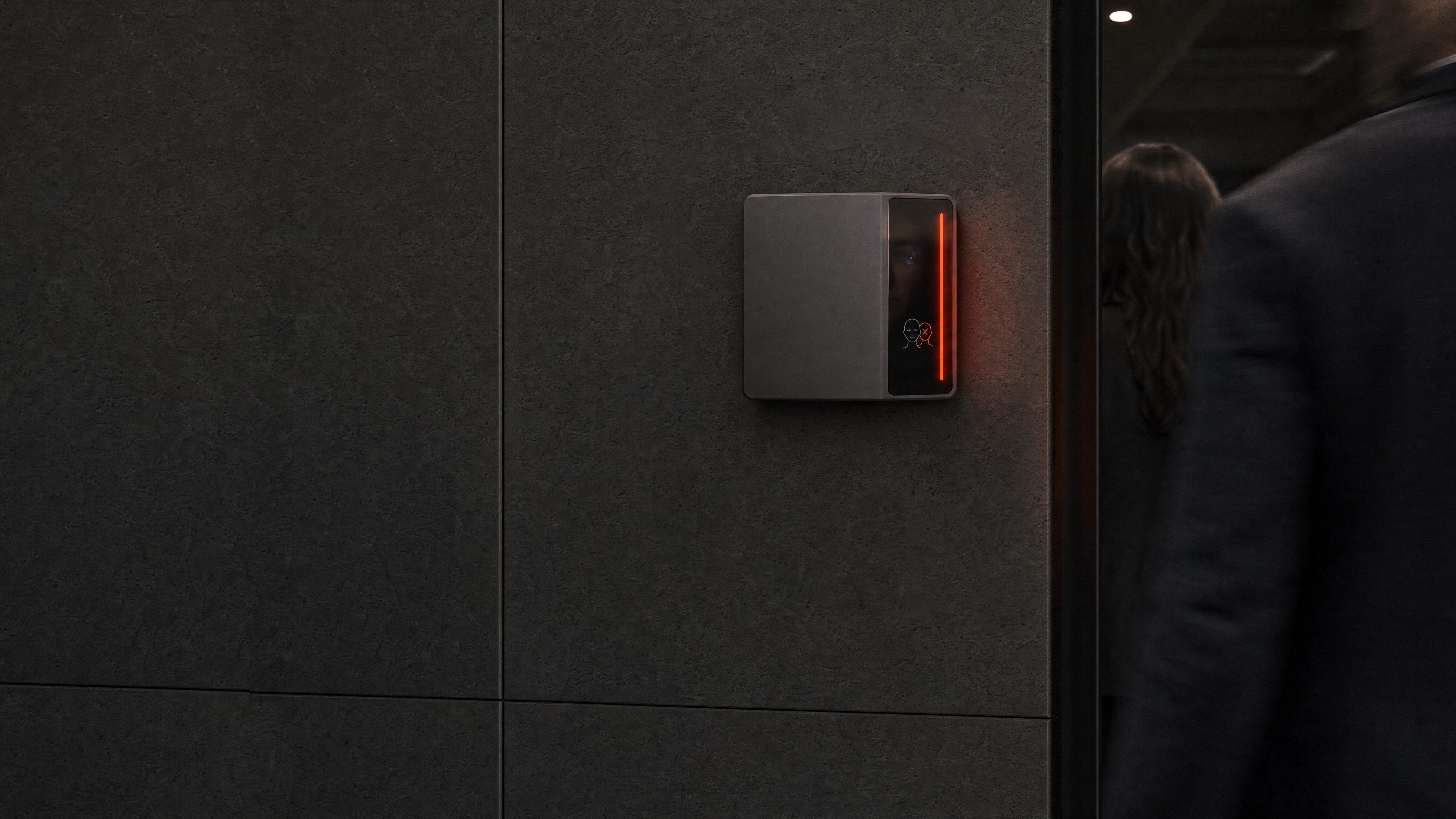 A Rock X reader on a dark stone wall glowing red as a second person follows someone through the doorway