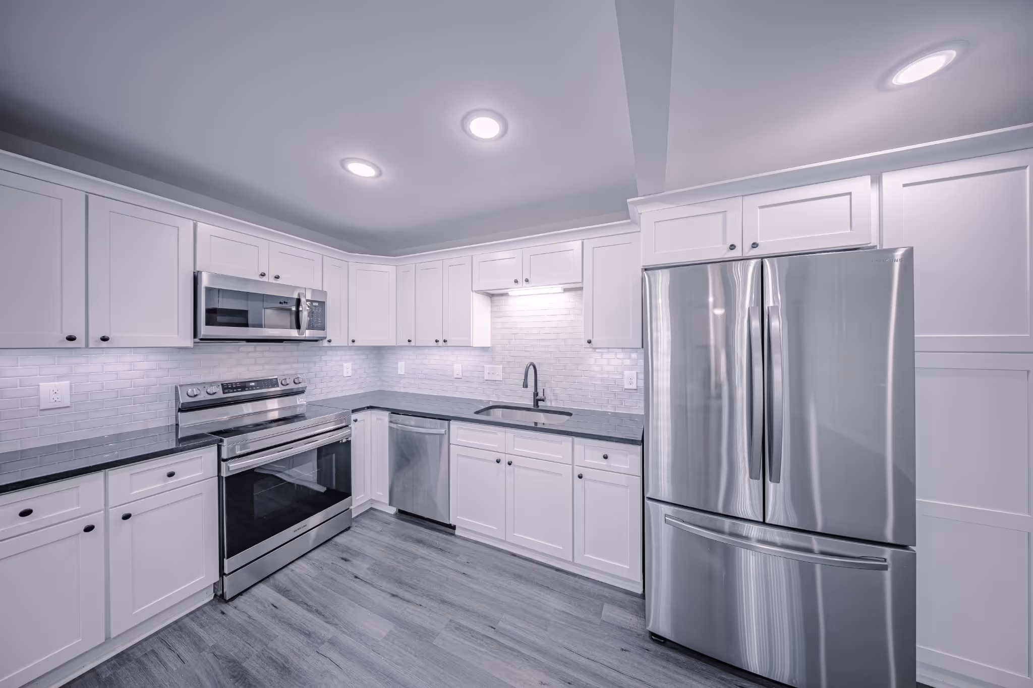 Sleek kitchen with white cabinetry at Apex apartment in Marietta GA