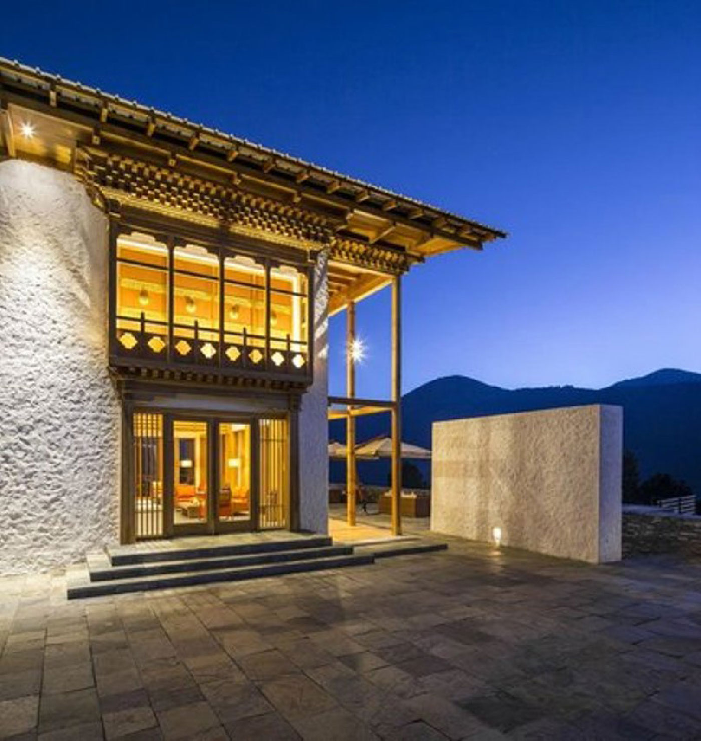 Illuminated cottage and balcony at Dhensa Boutique Resort