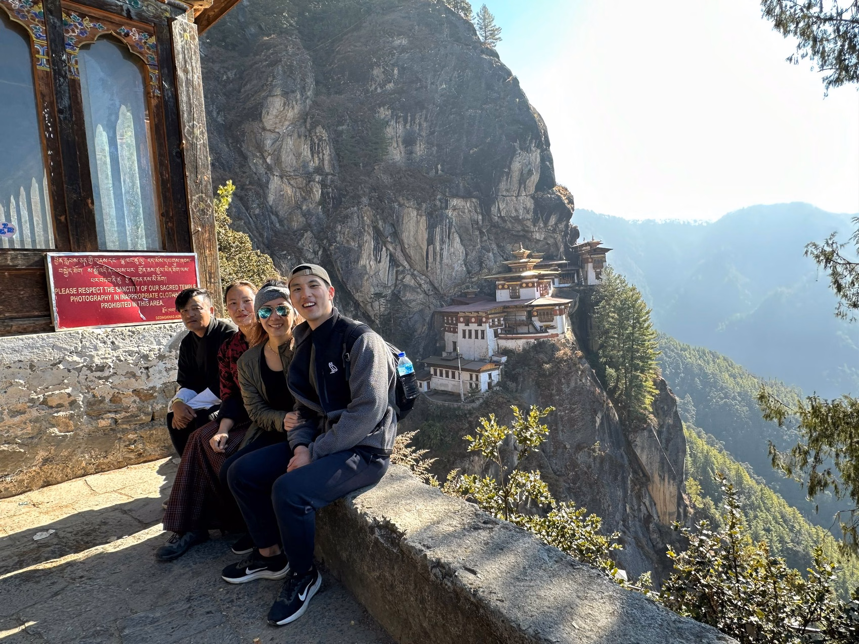 Guests pause at a viewpoint overlooking Tiger’s Nest Monastery in Paro, Bhutan.