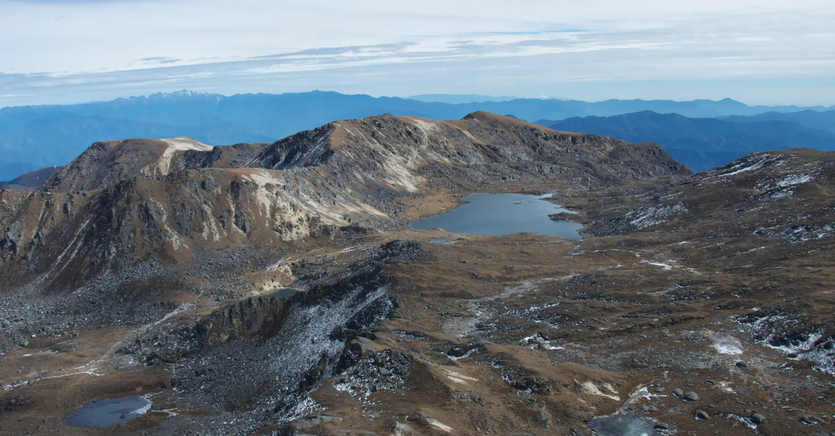 Alpine lakes among rocky ridges on the Dagala Thousand Lakes Trek in Bhutan.