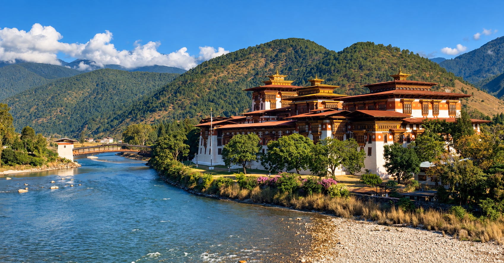Punakha Dzong beside the river and forested hills in Punakha, Bhutan