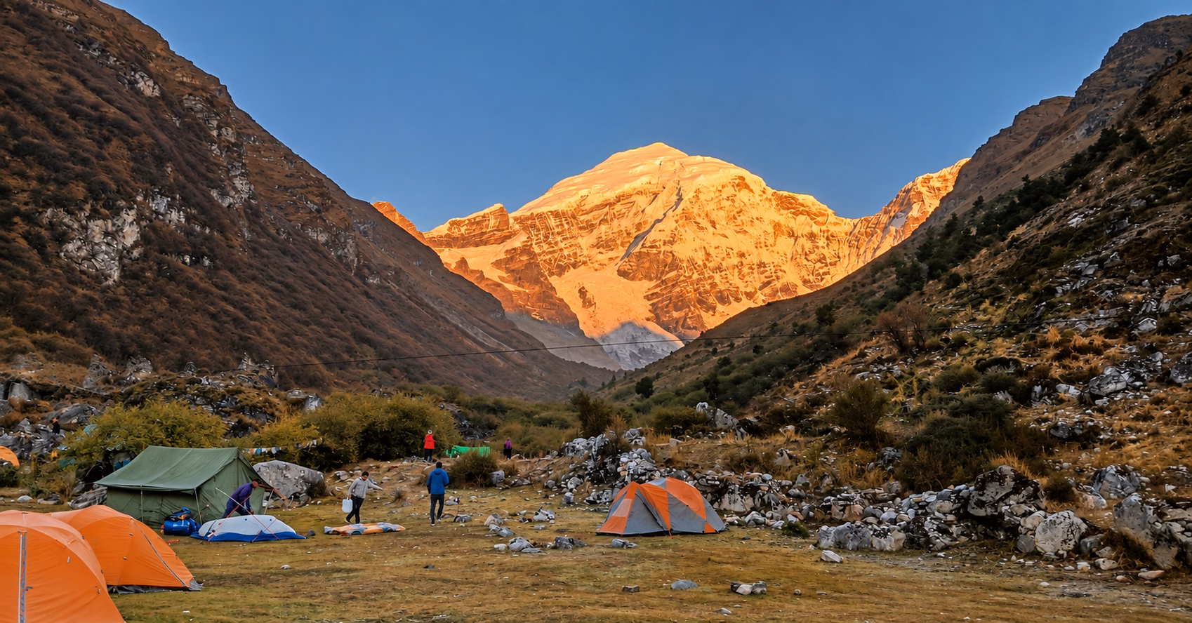 Golden morning light on Jomolhari above a trekking campsite in Bhutan