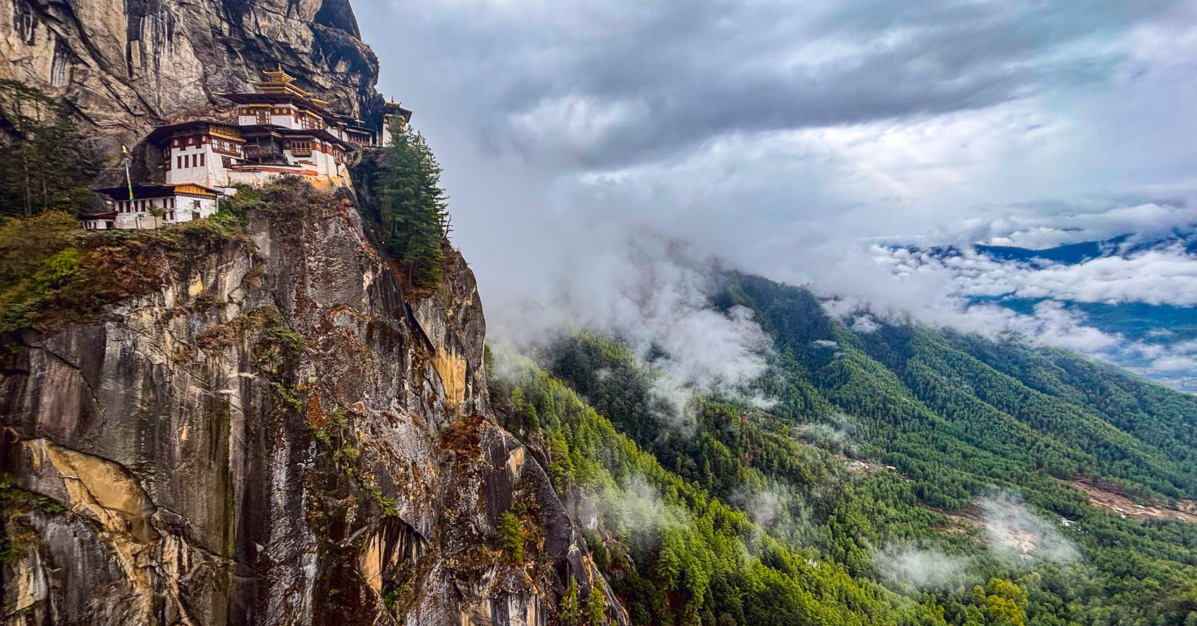 Tiger’s Nest Monastery on its cliff above a mist-filled forested valley near Paro