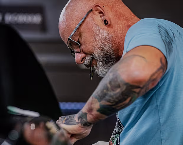 a man fixing a car