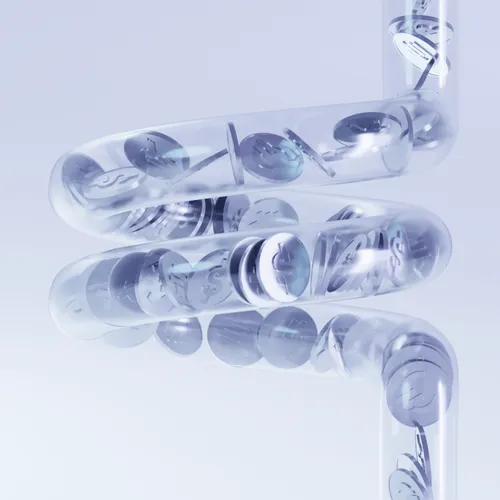 Transparent spiraled tubes filled with coins marked with dollar symbols.