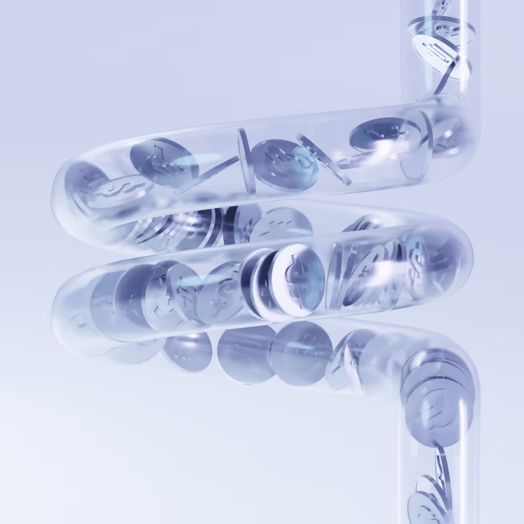 Transparent spiraled tubes filled with coins marked with dollar symbols.