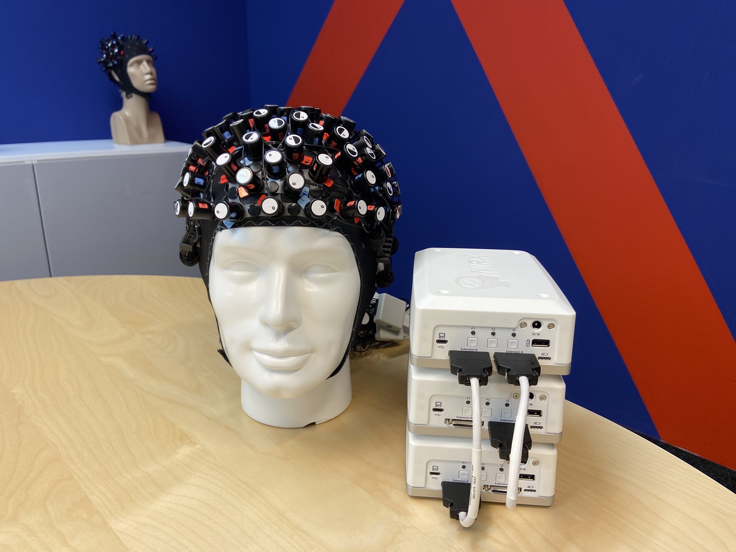 High-density arrangement with 48 sources and 48 detector arrangement with 3 connected fNIRS NIRSport2 devices.