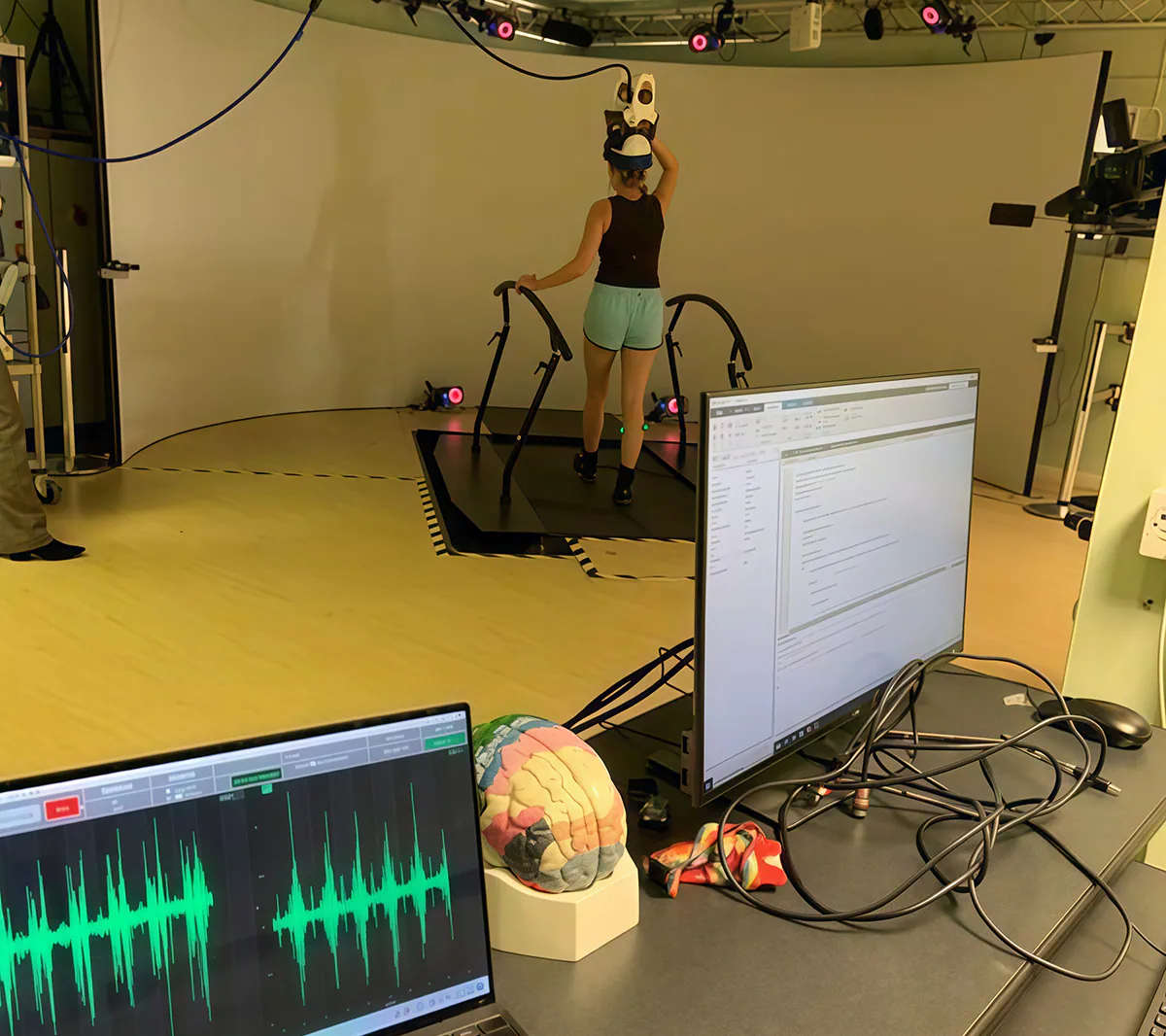 Participant completing TMS and EMG protocol on treadmill at Cardiff University