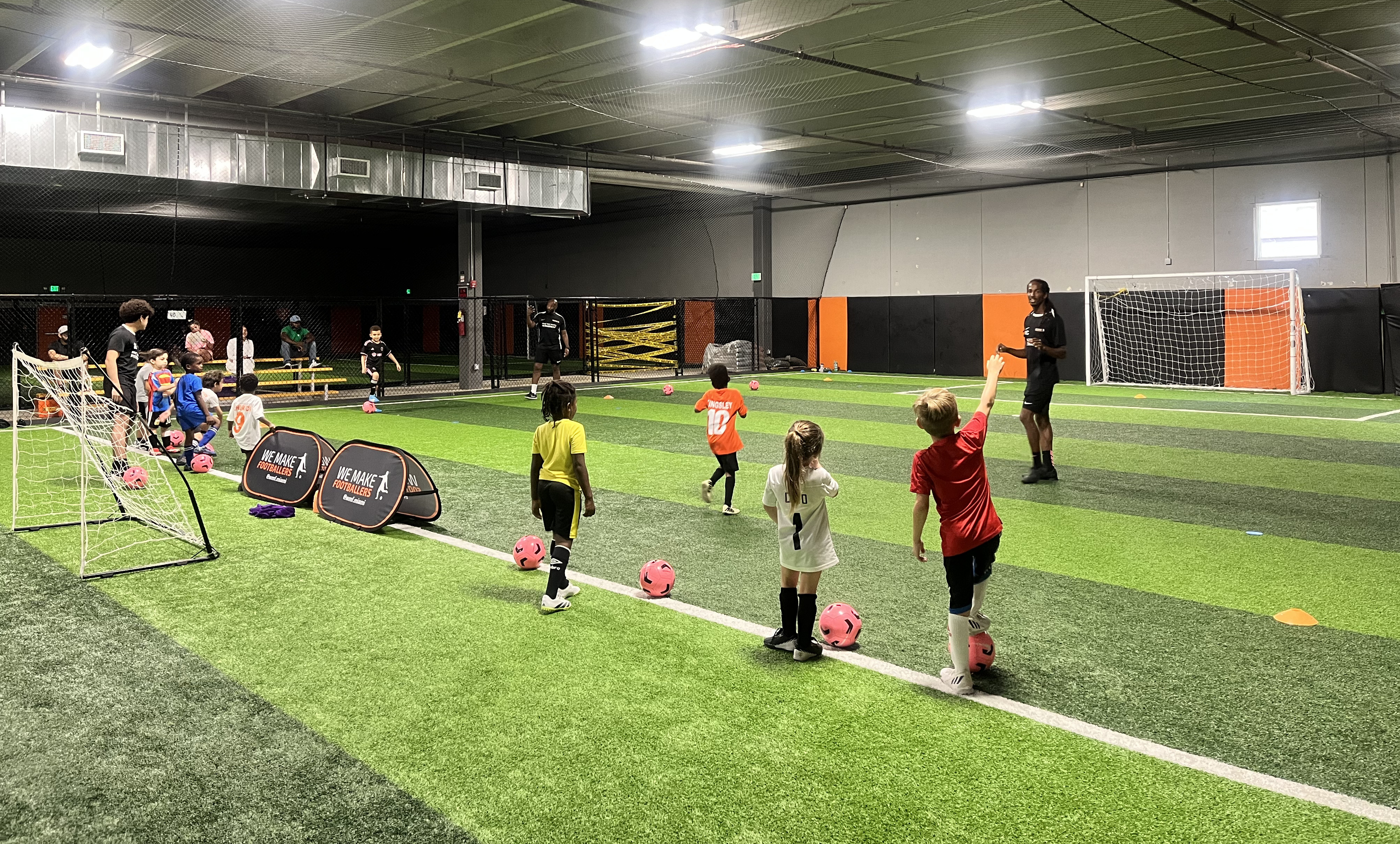 Young player enjoying post-game joy, building confidence through sport.