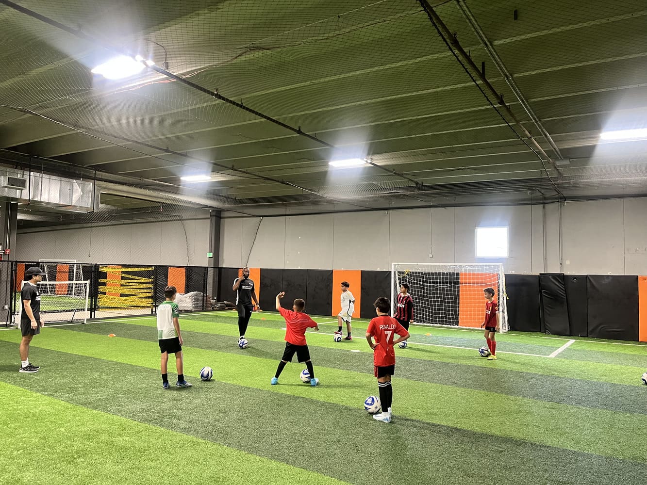 Children enjoying soccer at We Make Footballers Miami in a fun, friendly setting.