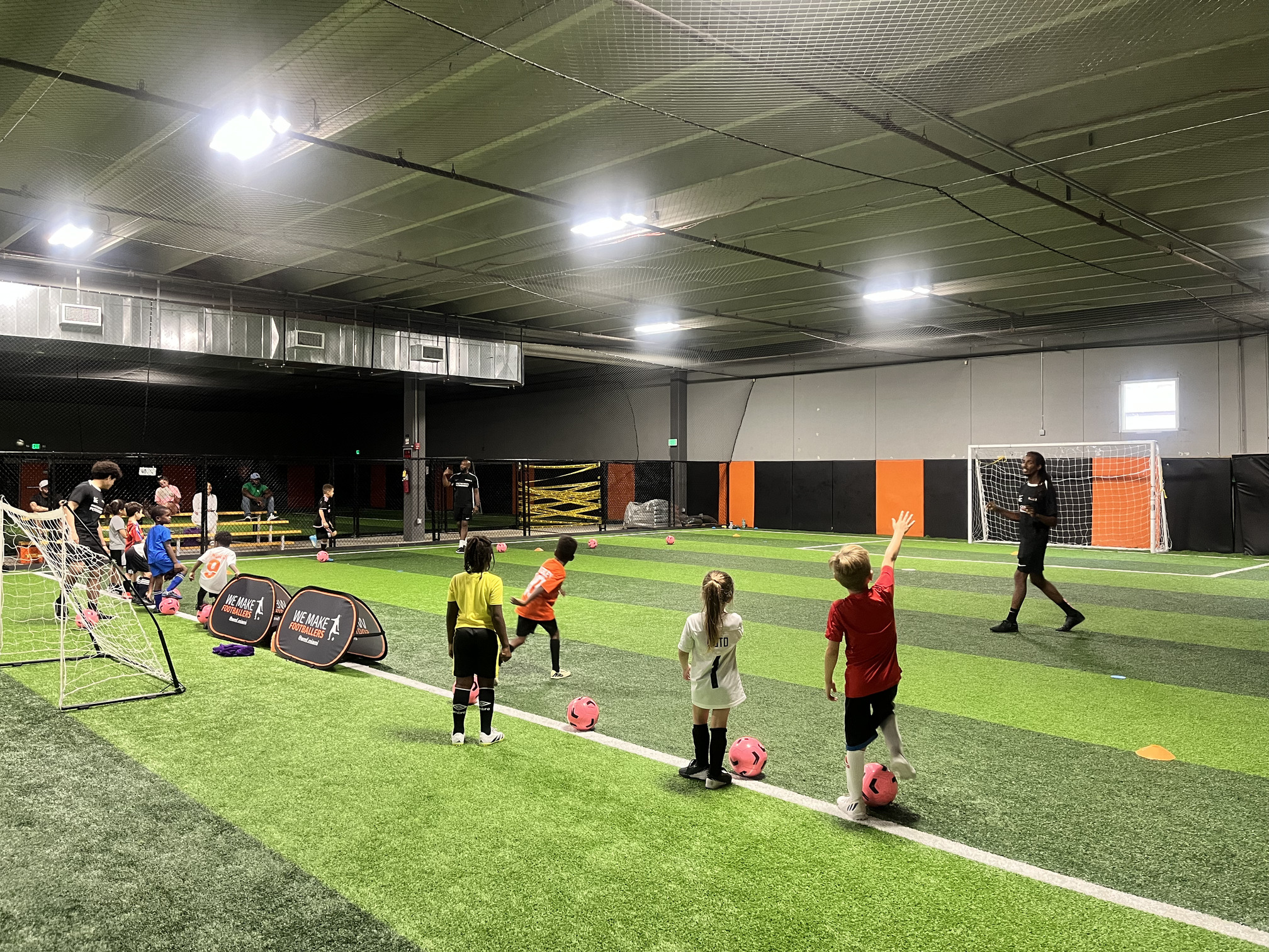 Pre-practice moment: child excited for regular soccer session.