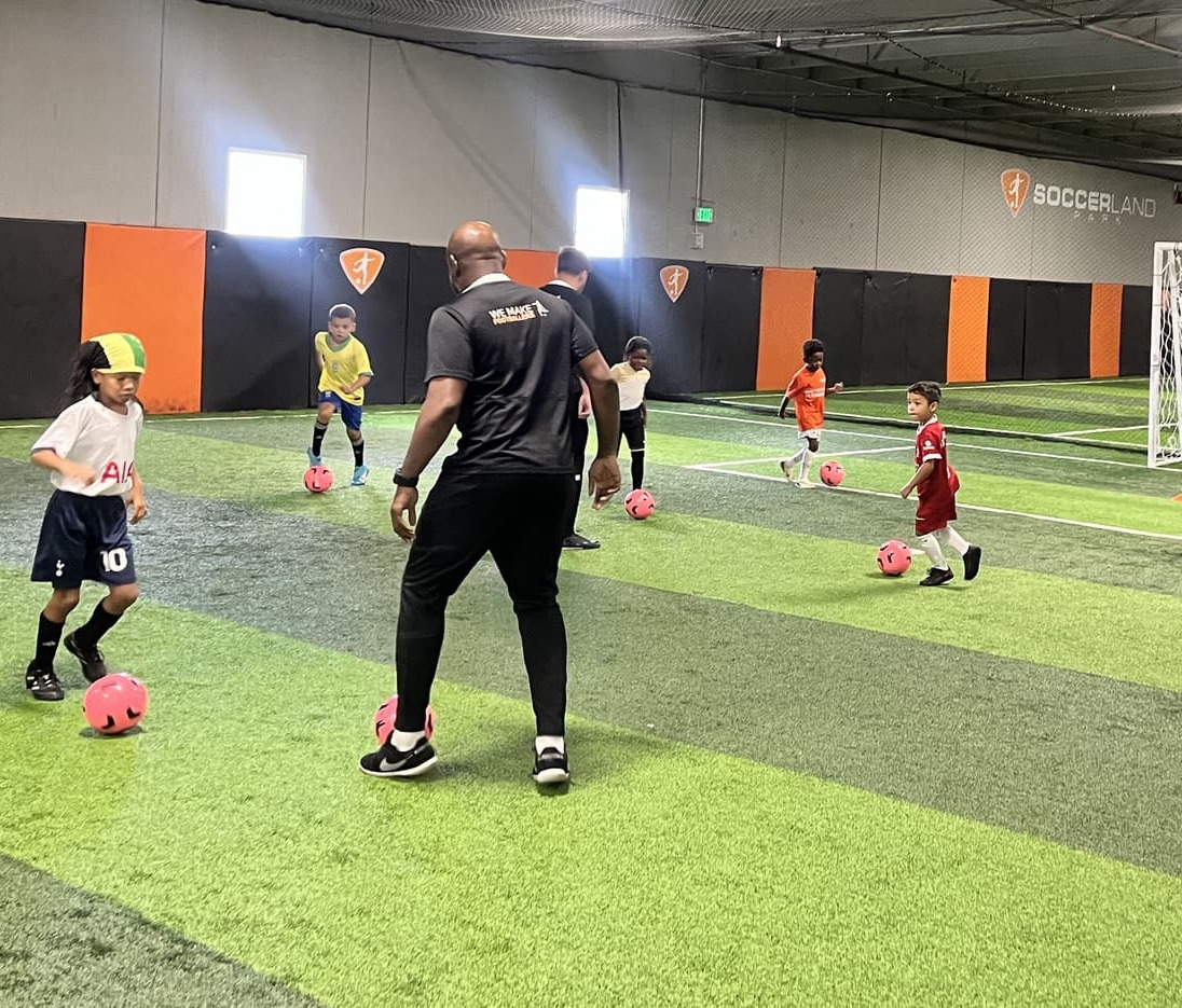 Children enjoying fast-paced small-sided football training.