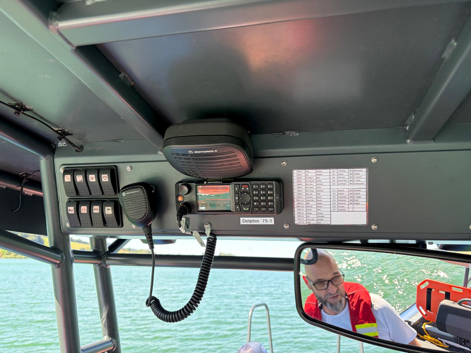 Marine radio and switch panel mounted under the T-top of the S585 Pro