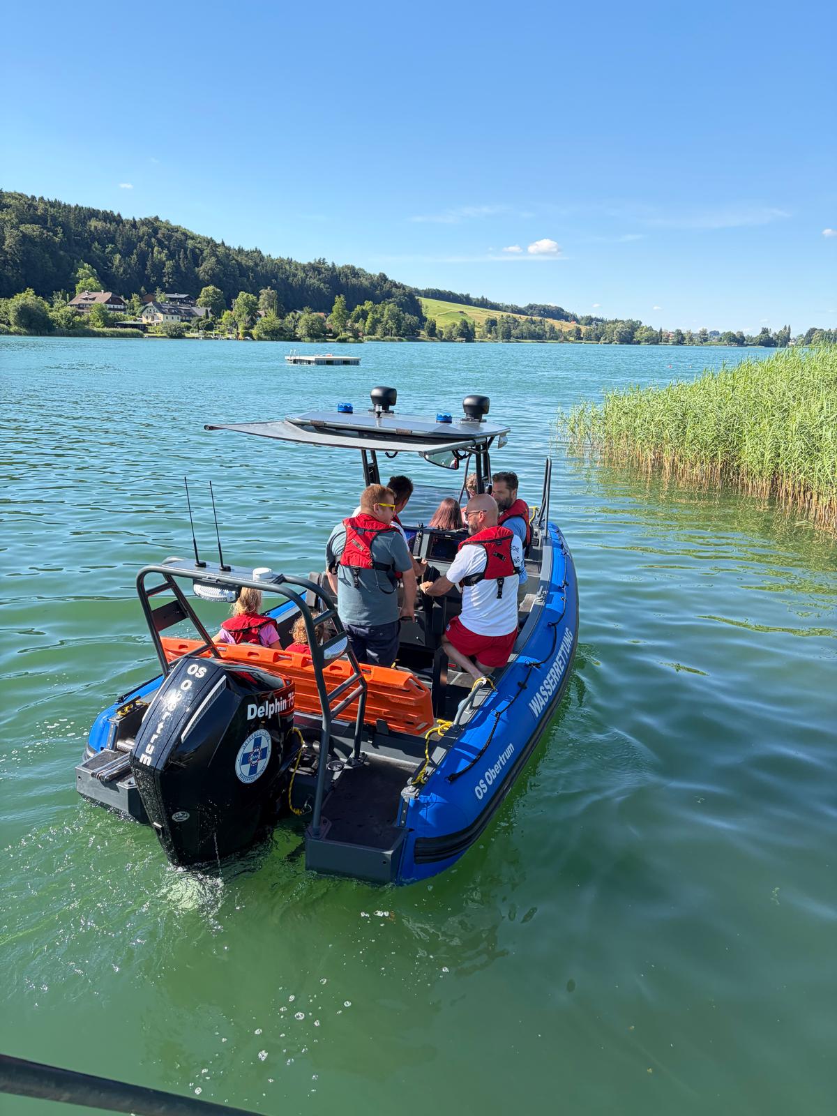 Wasserrettung Obertrum crew aboard the blue S585 Pro aluminium RIB on the Obertrumer See