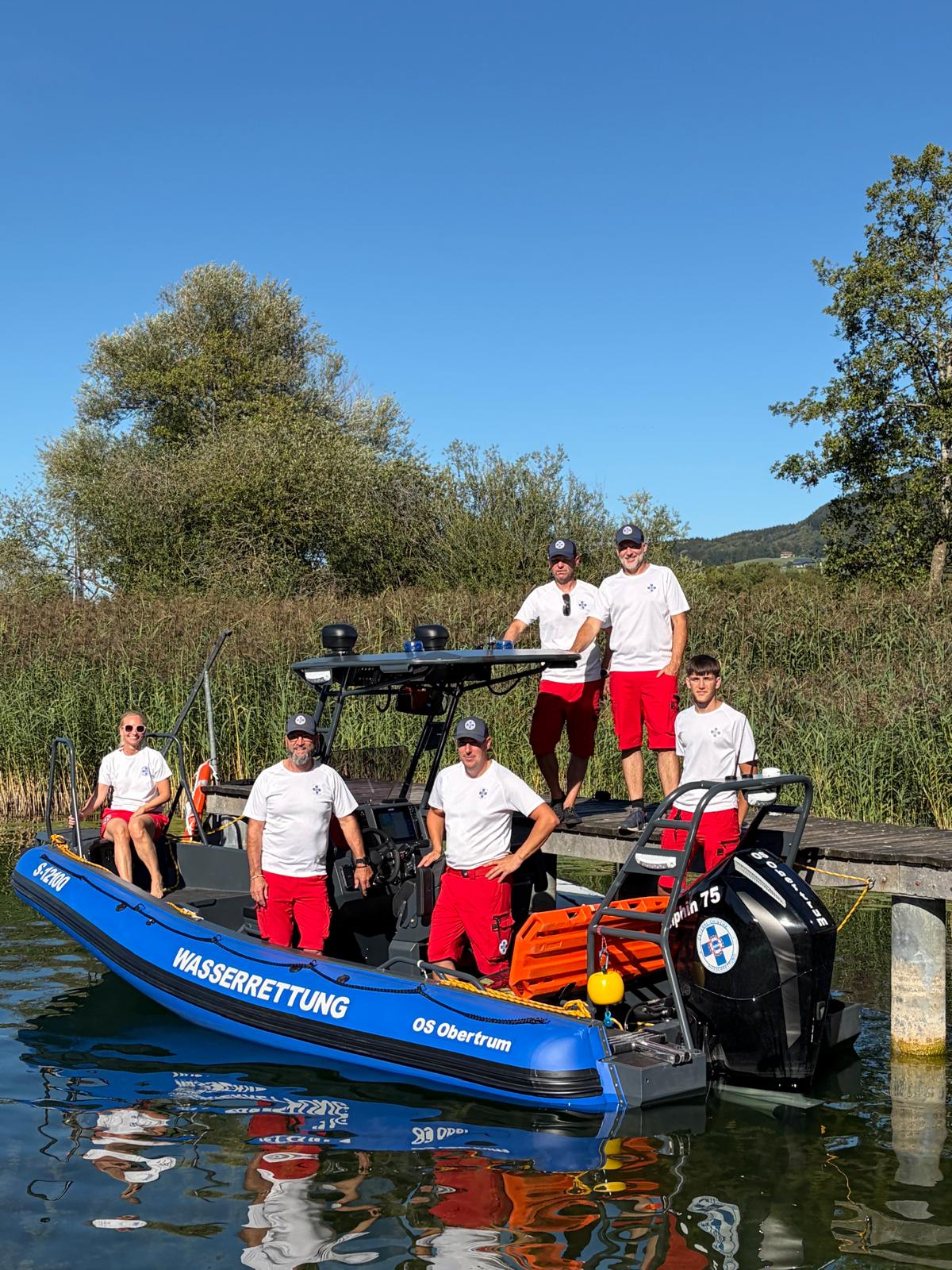 Rescue crew aboard the Aquaspirit S585 Pro marked WASSERRETTUNG OS Obertrum