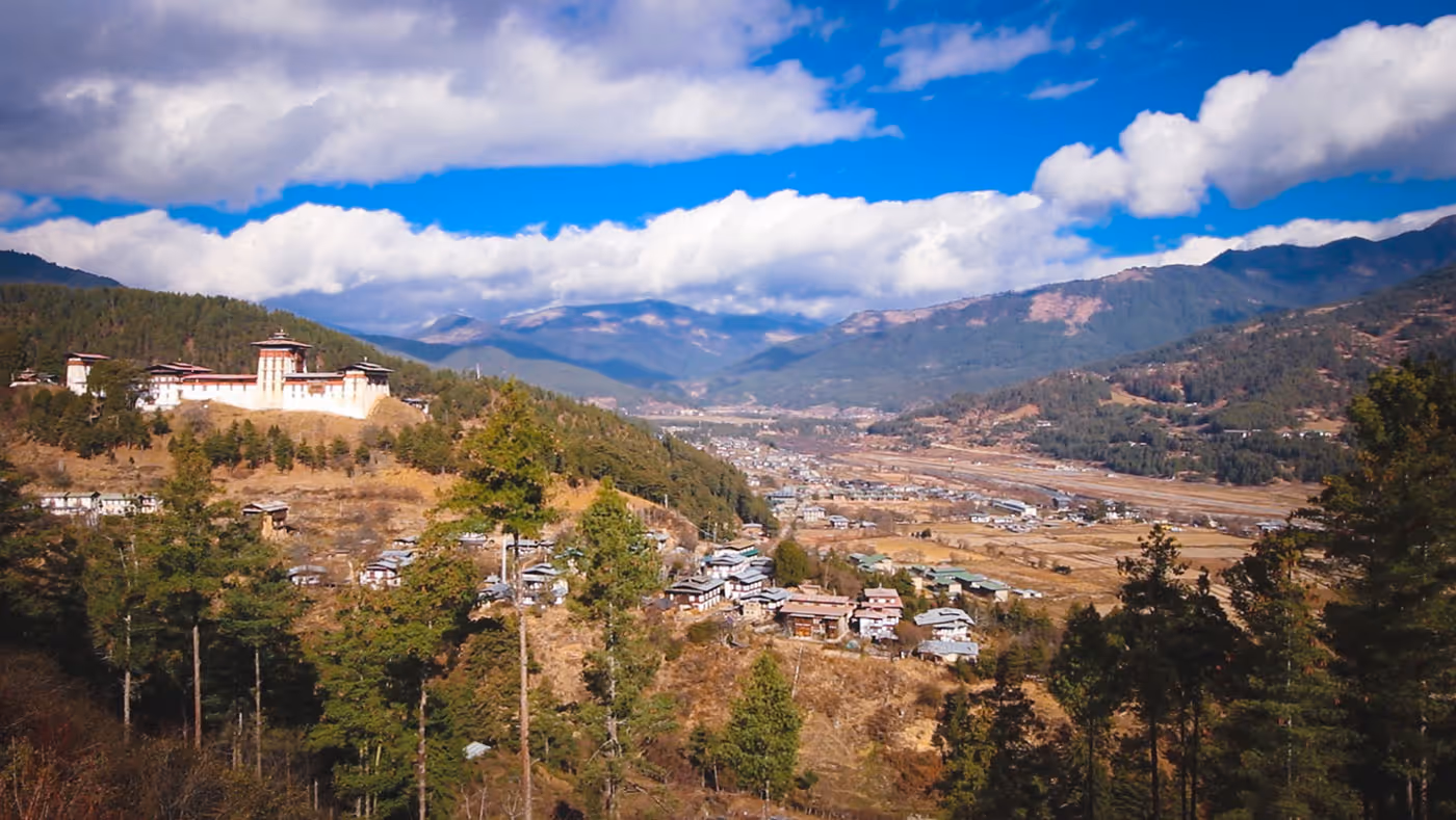 Scenic view of Jakar Dzong overlooking Bumthang valley and town, showcasing Bhutan’s spiritual heart and serene Himalayan landscape.