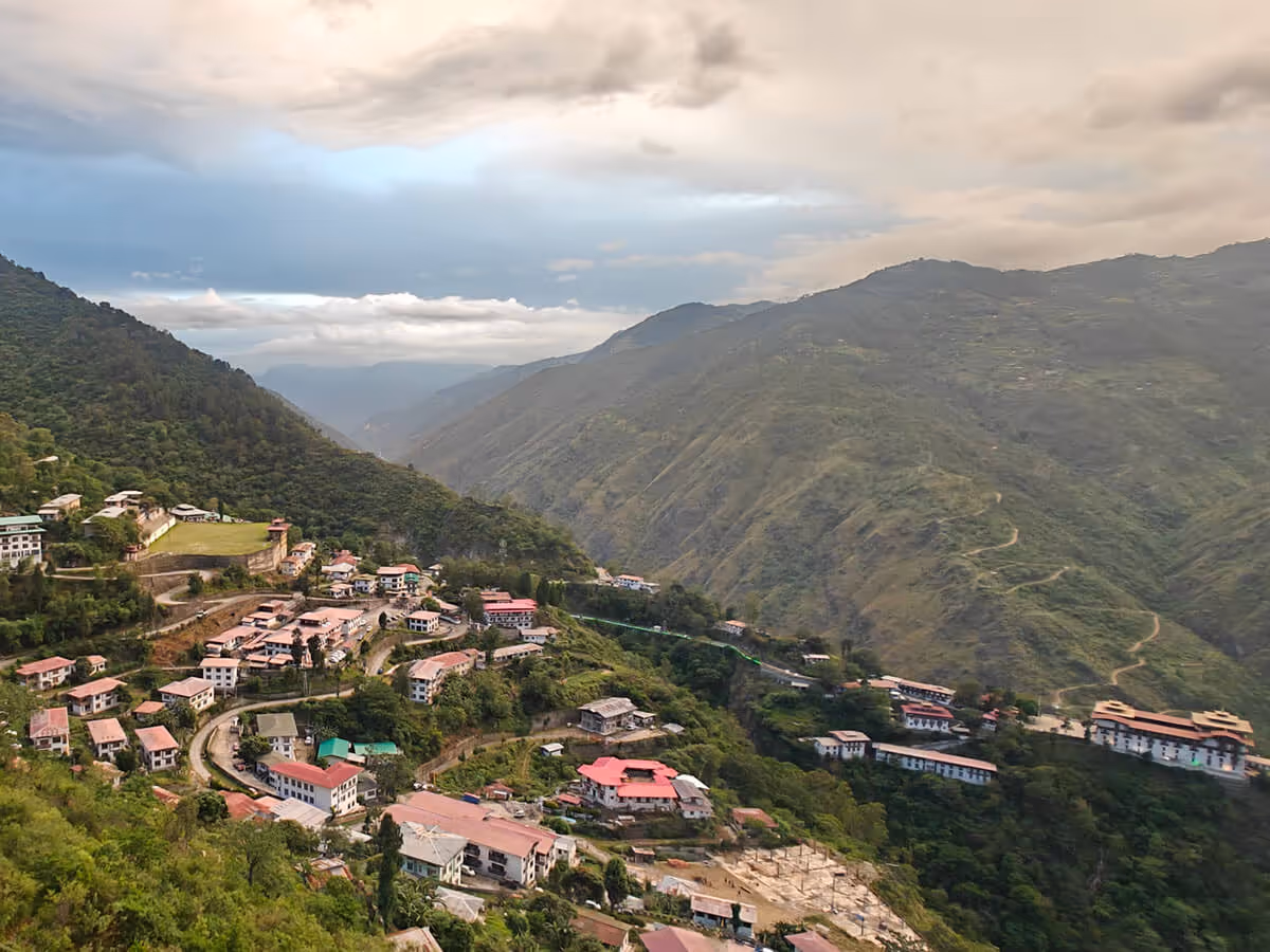 Trashigang town nestled in lush mountains, with its hilltop fortress.