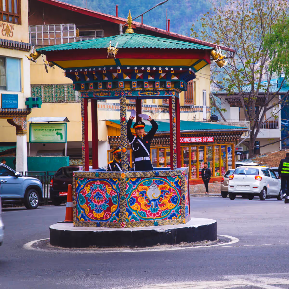 Thimphu traffic police directing at traditional booth.