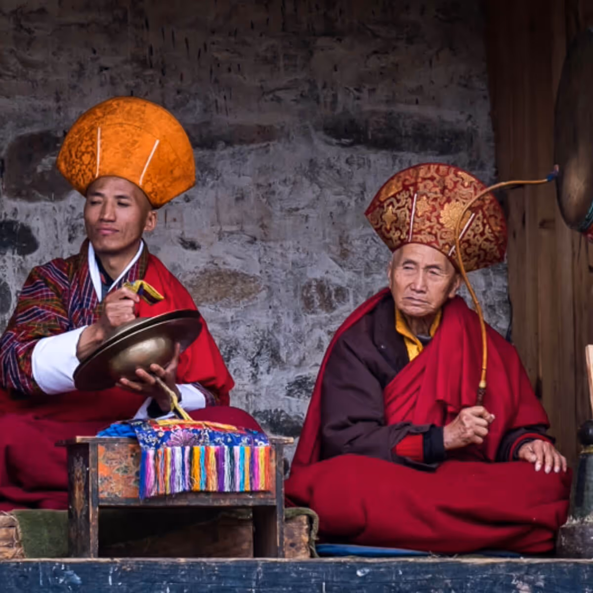 Monks playing instruments at Jambay Lhakhang Festival Bhutan