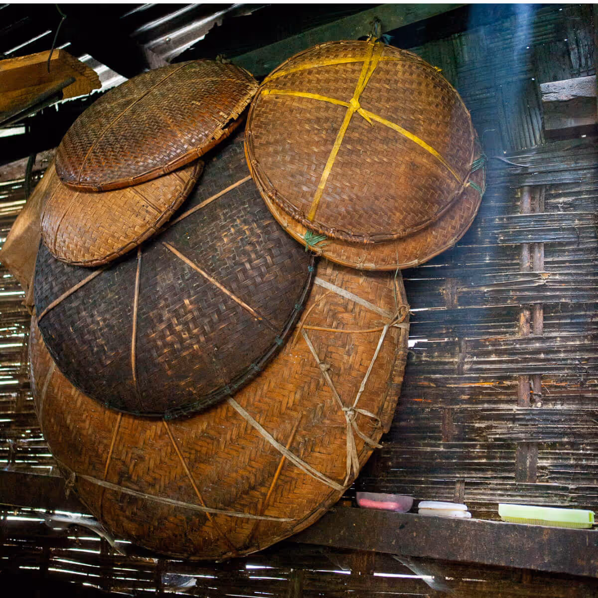 Traditional woven bamboo baskets hanging in Bhutanese farmhouse