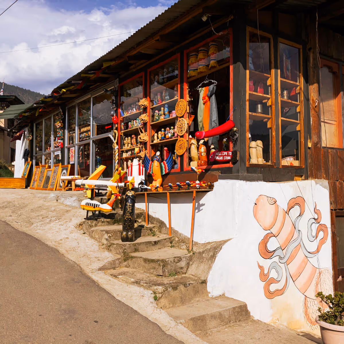 Colorful souvenir shop with phallus symbols on the way to Fertility temple hike in Punakha.