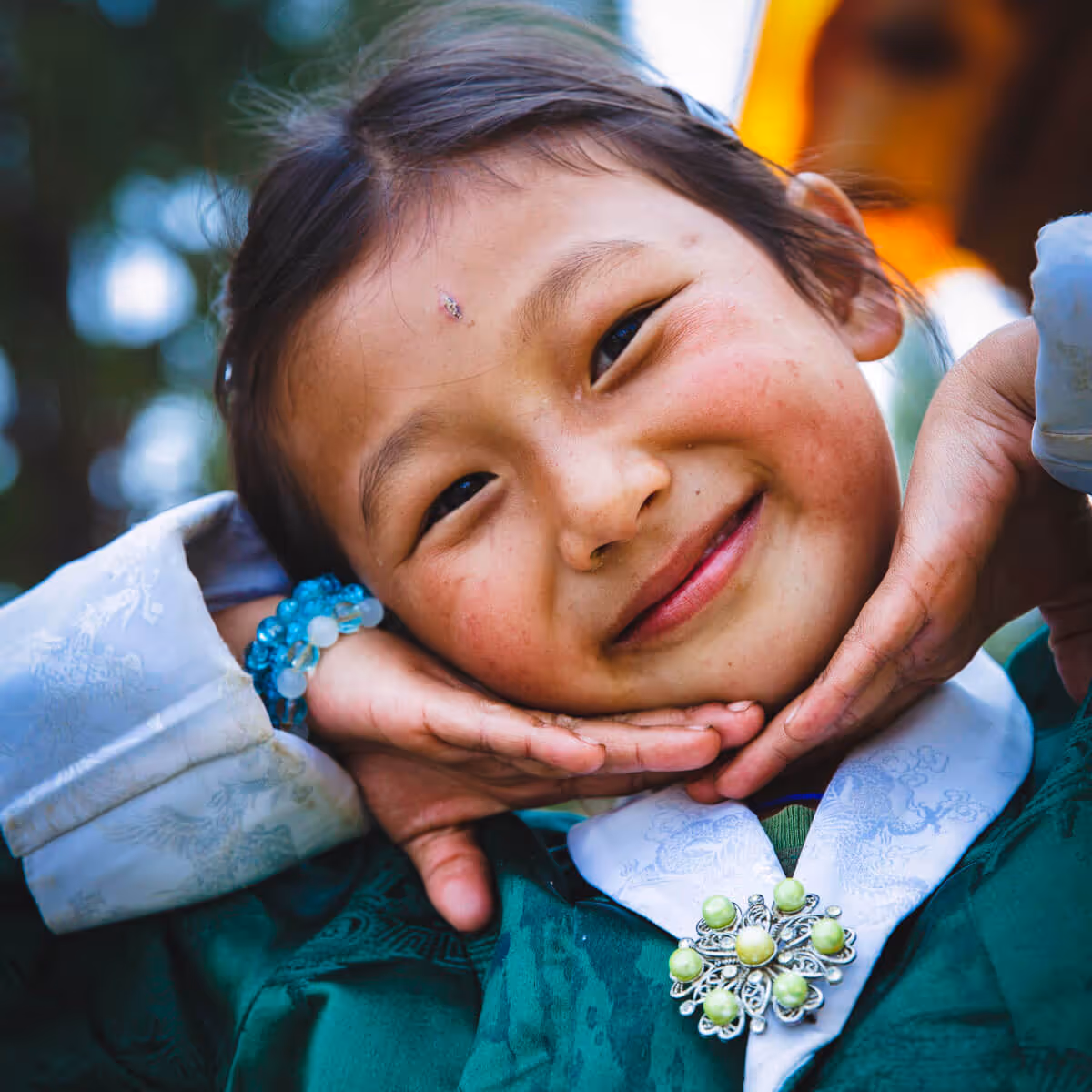 Smiling Bhutanese girl in traditional dress close-up