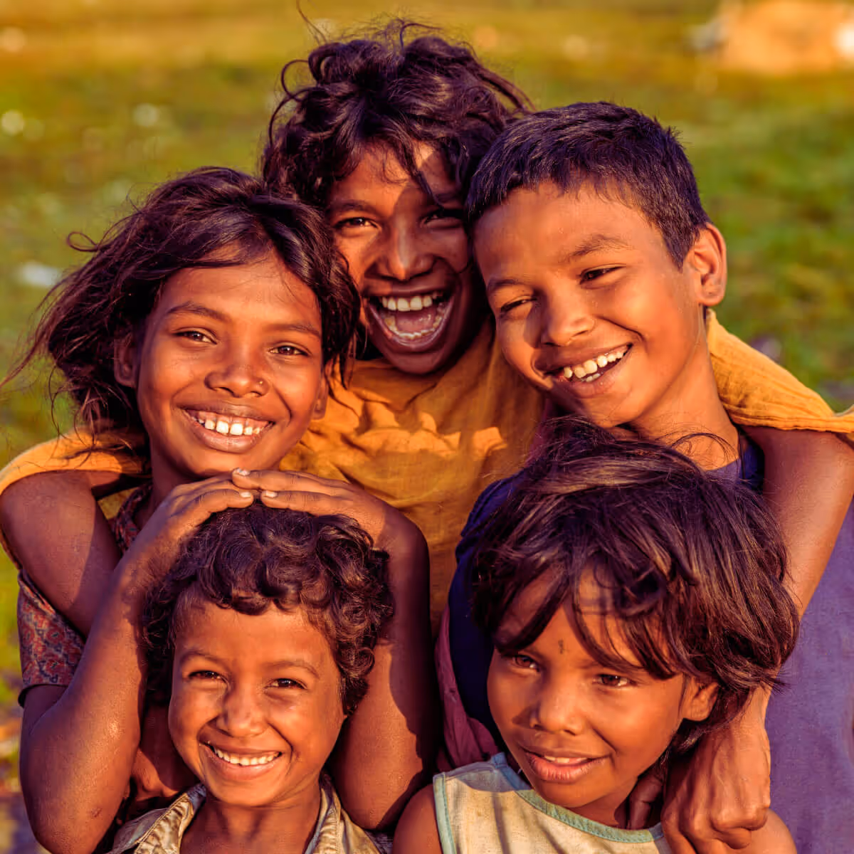 Smiling Nepali children in warm golden light