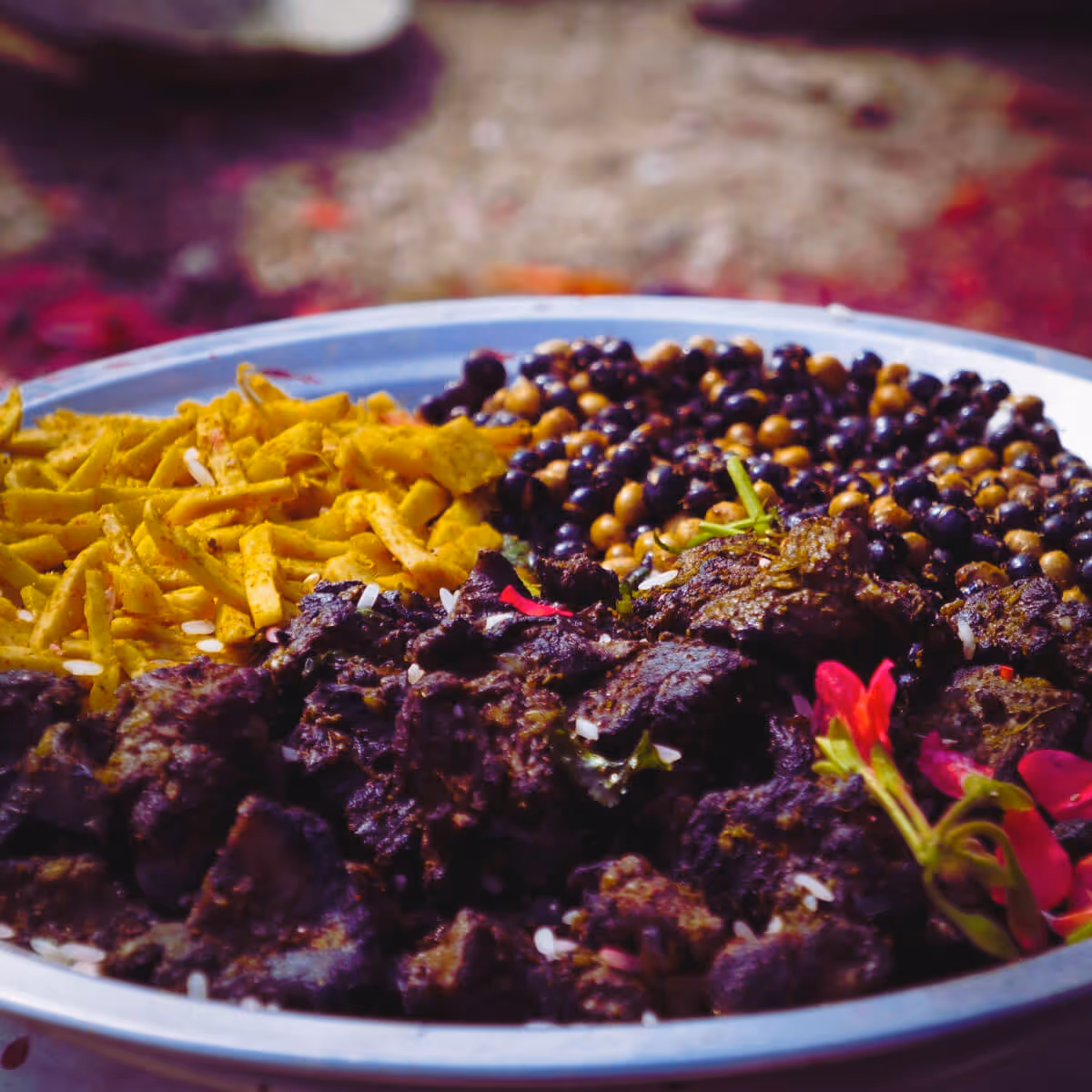  Traditional Newari plate with spiced meat and crunchy snacks in Nepal