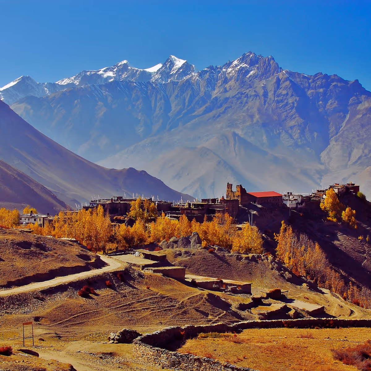 Himalayan village landscape with snow peaks in Nepal