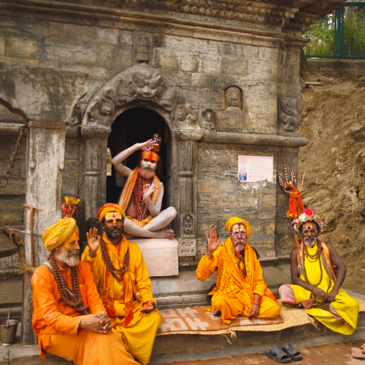 Sadhus sitting outside a temple in Nepal