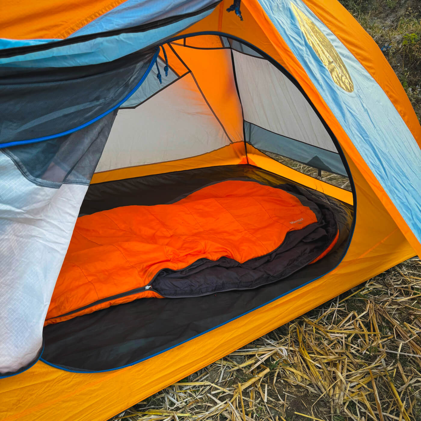 Interior view of a Raven Tours trekking tent showcasing a high-quality sleeping bag and durable gear for Bhutan wilderness camping