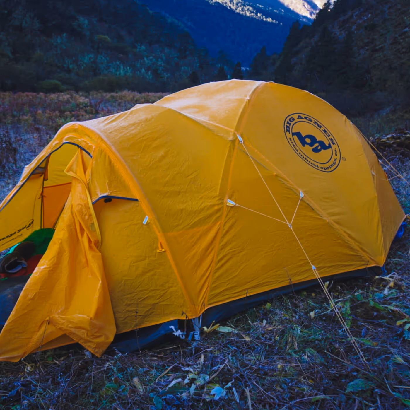 Bright yellow expedition tent pitched on the Sagala Trek, nestled amidst Bhutan’s wild, untouched landscapes