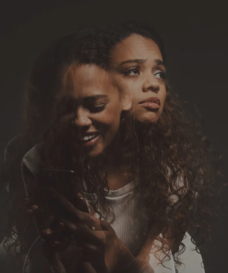 Double exposure of a woman showing contrasting emotions: smiling and looking down, and looking serious and pensive.