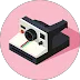 Icon of a vintage camera with a large lens and viewfinder on a pink circular background.