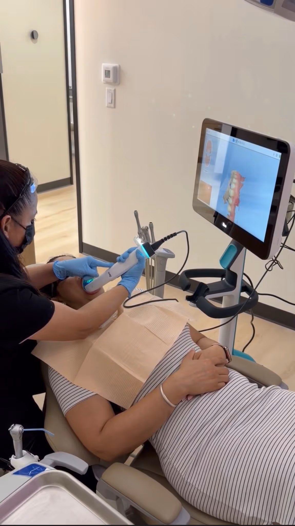 Patient receiving Invisalign treatment at Clayton Dental Studio in Atascocita