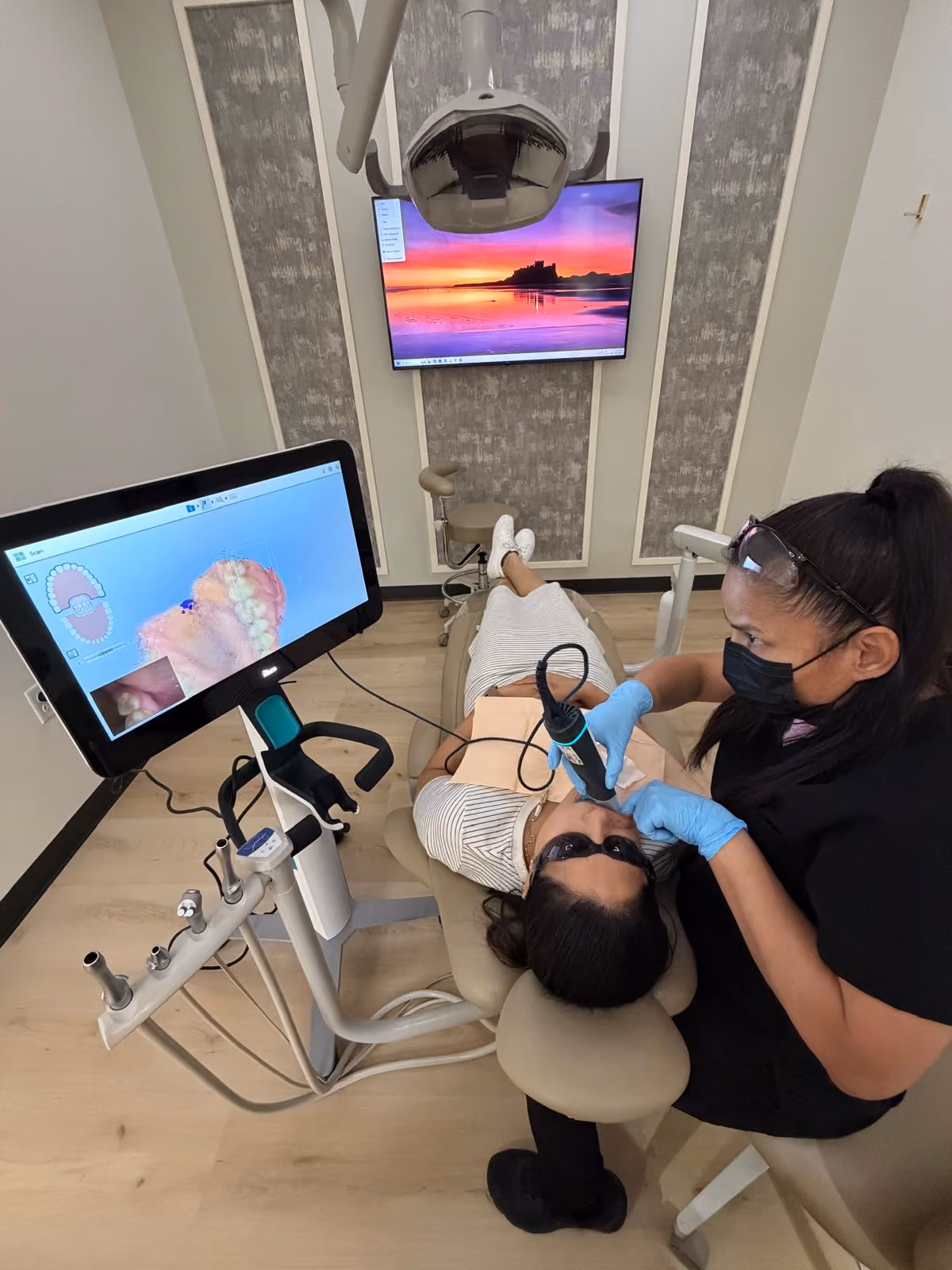 Experienced cosmetic dentist in Atascocita performing a smile makeover consultation.