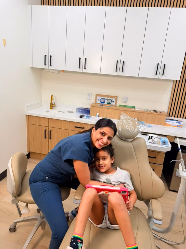 Experienced cosmetic dentist in Atascocita performing a smile makeover consultation.