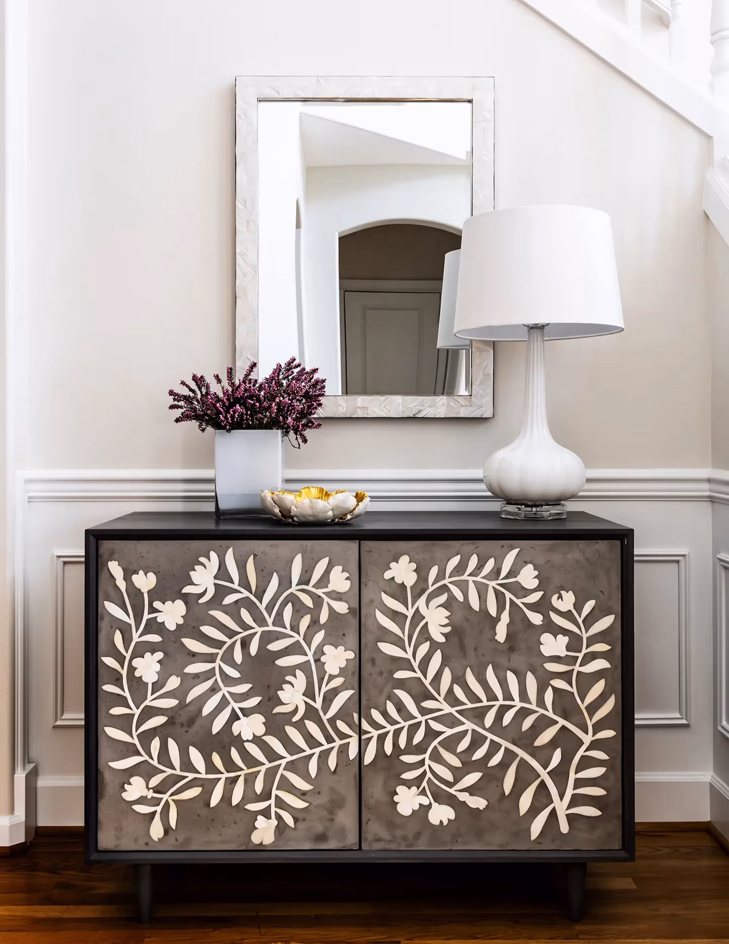 A full refresh of the entry, living, dining, and family rooms in an Edmonds, WA home — custom rugs, drapery, wallpaper, and curated art throughout.
