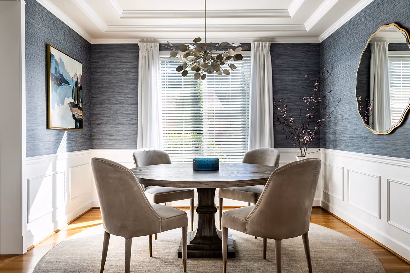 A full refresh of the entry, living, dining, and family rooms in an Edmonds, WA home — custom rugs, drapery, wallpaper, and curated art throughout.